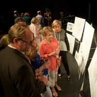 <p>Guests at Friday&#x27;s fundraiser look at plans for the Bedford Playhouse renovations.</p>