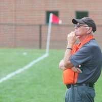 <p>Dover High boys soccer coach Bob Esposito watches his team at a preseason scrimmage.</p>