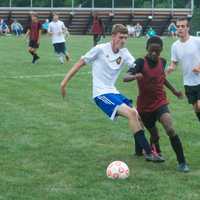 <p>The Dover High boys soccer team (in red) preps for the upcoming season at a recent scrimmage.</p>