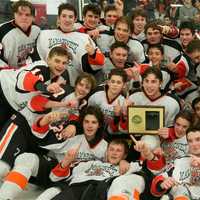 <p>Mamaroneck poses with the Section 1 championship trophy Sunday after beating Suffern at the Brewster Ice Arena.</p>