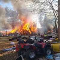 <p>Crews battling a fire in the area of 2351 Central Street in Stoughton on Saturday, Feb. 18</p>