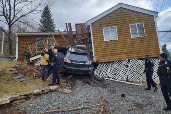 One Hospitalized, House Unlivable After Car Crashes Into Central Mass Home: Police