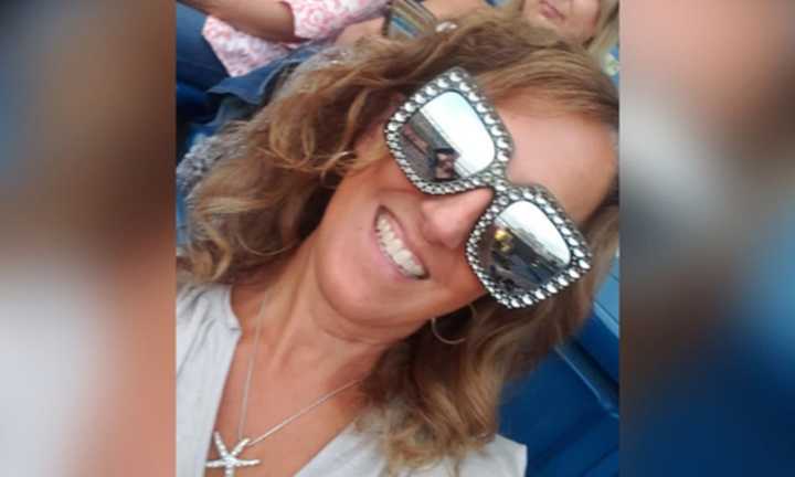 Lori Ann Medeiros attending an Elton John concert over the summer