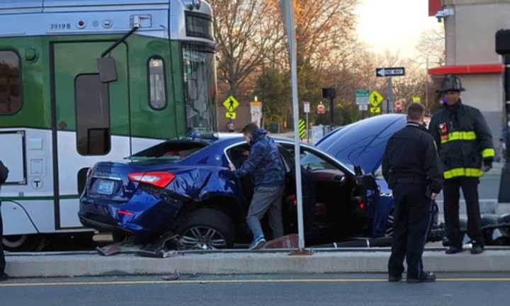 A car collides with a Green Line trolley near the BU Bridge in Boston on Wednesday, Nov. 23