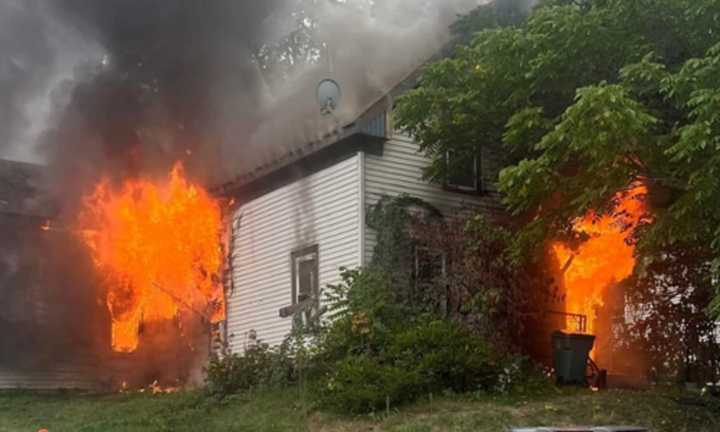 Flames shooting from the building at 34 Maple Street in Fitchburg