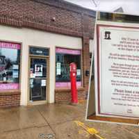 <p>A sign (front) inside 7and9 Bakery (back) announced the news that the shop will be closing at the end of March 2023</p>