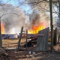 <p>Crews battling a fire in the area of 2351 Central Street in Stoughton on Saturday, Feb. 18</p>