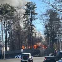 <p>Smoke billowing from a house behind Cobbs Corner in Stoughton on Saturday, Feb. 18</p>