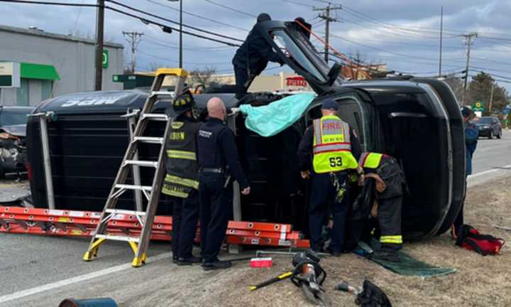 First responders on the scene of a rollover crash on Route 12 in Auburn on Monday, Feb. 6