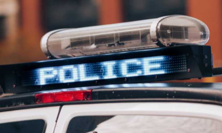 Close-up of a police car roof and sign