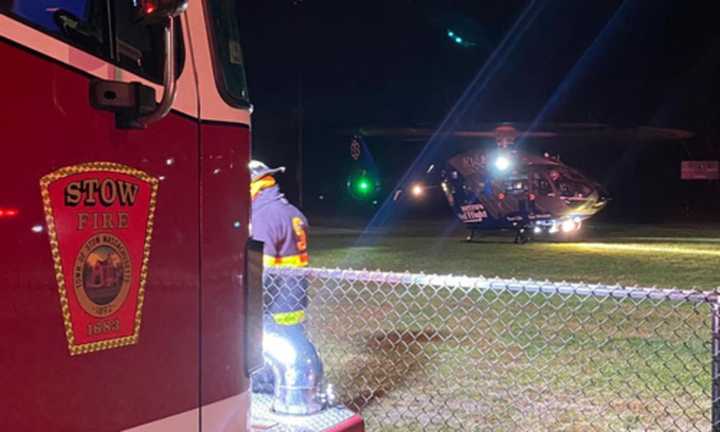 A Medflight helicopter lands in Acton to transport a patient who was trapped inside a burning building in Acton