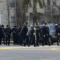 <p>SWAT officers leaving a situation at a Stoneham home on Wednesday, April 12.</p>