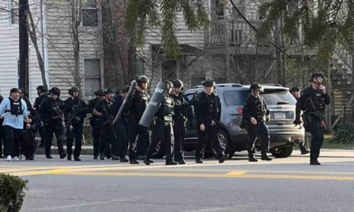 SWAT officers leaving a situation at a Stoneham home on Wednesday, April 12.