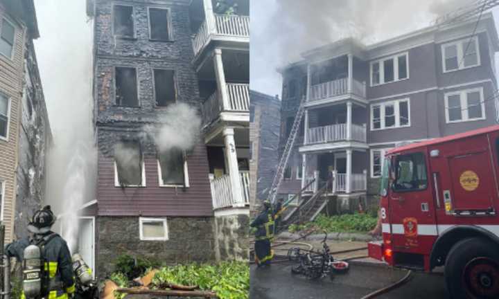 Crews battle the fire at 59 Wales Street in Dorchester