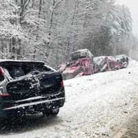 <p>New Hampshire State Troopers responded to a car carrier crash on I-89 in Warner, NH, and found that one of the cars had rolled off the carrier and landed in the road</p>