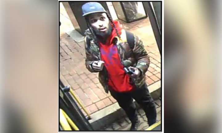 Transit Police are looking to identify this man after a woman was shot on a bus outside Andrew Station in South Boston on Friday evening