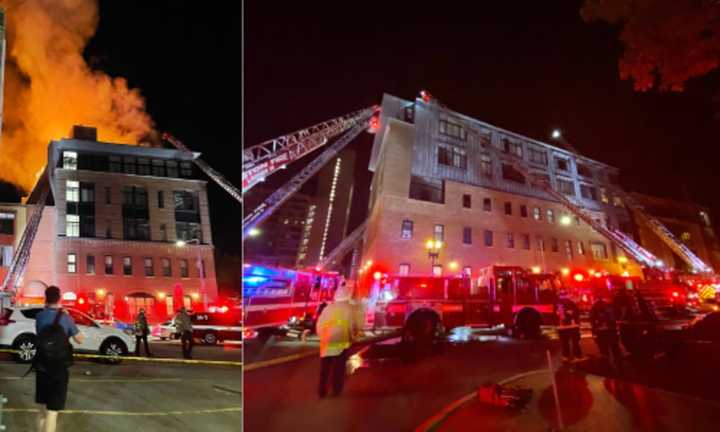 Crews work to extinguish a 3-alarm fire in Roxbury