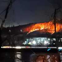 <p>Noticeable flames from the fire that was visible from the Mass Pike</p>