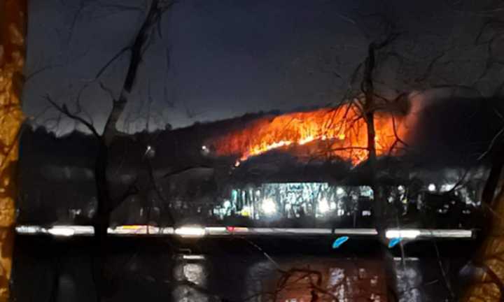 Noticeable flames from the fire that was visible from the Mass Pike