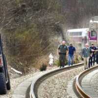 <p>The MBTA train engineer was able to stop just short of the woman lying on the tracks.</p>