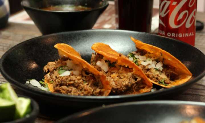 The best birria tacos are filled with a slow-cooked meat  and then dipped in the braising liquid.