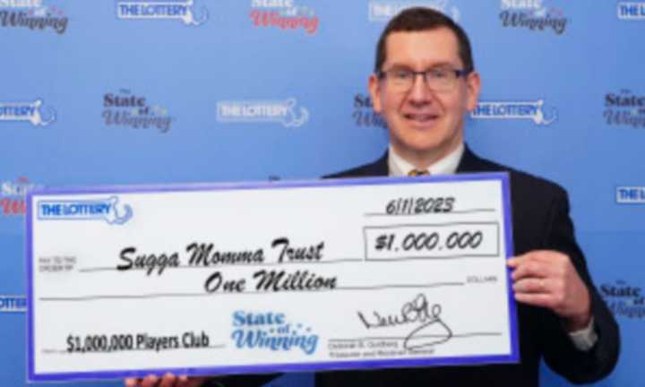 The trust was represented by Christopher Latham, who picked up the $1 million check.