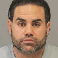 Long Island Man Nabbed For Threatening Business Owner With Handgun, Police Say