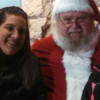 <p>Santa greets some friends in Demarest Tuesday night: Dawn Schiraldi, left, and Giann Schiraldi, right. </p>
