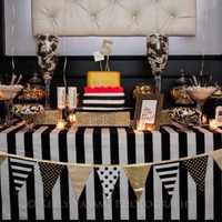 <p>A sophisticated vision in black, white and gold, this candy buffet was created by Dive in Sweets.</p>