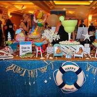 <p>A beach-themed candy buffet created by Dive in Sweets even included gummy sharks.</p>