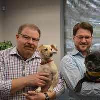 <p>Richard Delaney holds Cooper and Jonathan Seidman holds Mr. Chops at Delaney Computer Services in Mahwah.</p>