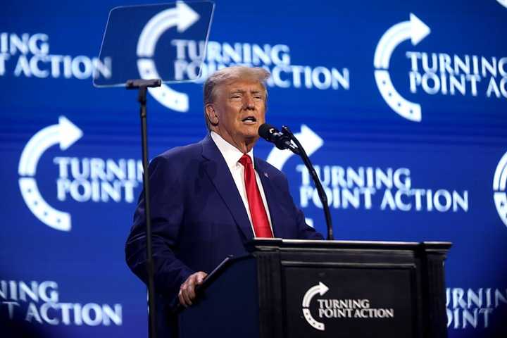 Former President Donald Trump speaking at the 2023 Turning Point Action Conference in West Palm Beach, Florida.
  
