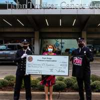 <p>Firefighter Joseph Derienzo, Nancy Kennedy of Hackensack Meridian Health and Park Ridge Firemen&#x27;s Association Vice-President Kyle Ladewig.</p>