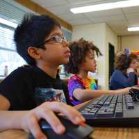 <p>Students at the Dows Lane Elementary School in Irvington use their imaginations and what they learned in computer class to blast through coding exercises.</p>