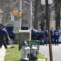 <p>Detectives work the scene of the crash and bailout following a pursuit in East Orange on Sunday, March 26.</p>