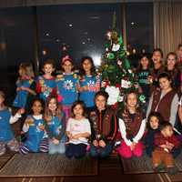 <p>Daisies and Browns gather around the finished tree.</p>