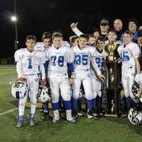 <p>North Arlington&#x27;s Junior Vikings with the championship trophy after their high-scoring game against Hasbrouck Heights.</p>