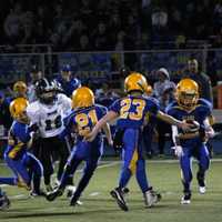 <p>Lyndhurst quarterback Tyler Collins hands off to Nathaniel Barriteau early in the Pee Wee Super Bowl against New Milford.</p>