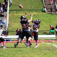 <p>Pee Wee Aviator Jake Summer blocks Manchester quarterback Brandon Marrero late in the game.</p>