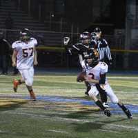 <p>The Hasbrouck Heights quarterback looks for the end zone during the Super Bowl game against Carlstadt-East Rutherford.</p>