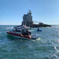 <p>The capsized boat near the Middle Ground lighthouse.</p>