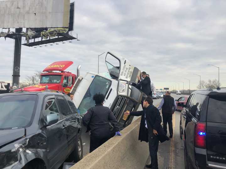 New York Gov. Andrew Cuomo helped a trapped passenger in a car on the Brooklyn Queens Expressway.