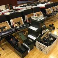 <p>The arsenal of weapons, cash, and drugs seized by Nassau County Police in Farmingdale</p>