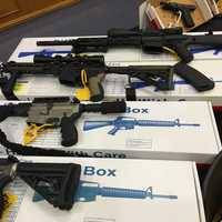 <p>The arsenal of weapons, cash, and drugs seized by Nassau County Police in Farmingdale</p>