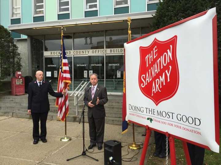 County Executive Ed Day is pictured with Salvation Army Maj. Marcus Jugenheimer making the first donation of the 2015 holiday season.