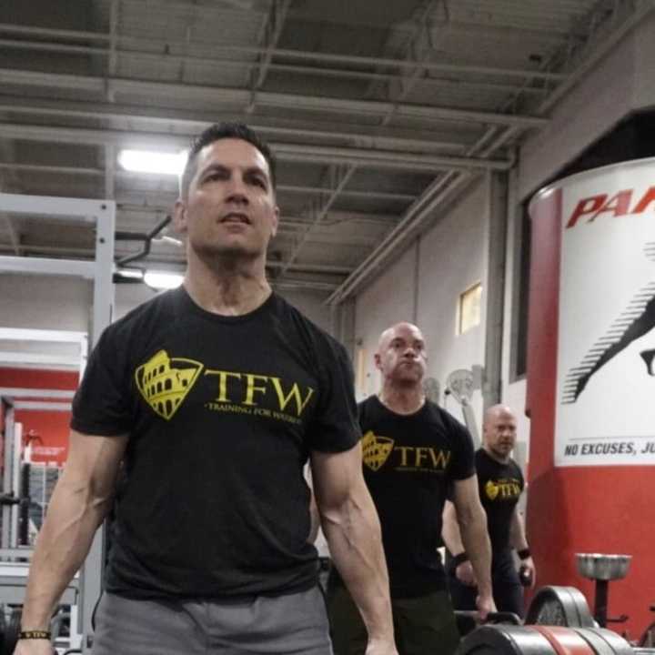 Wood-Ridge&#x27;s Jeff Geisler deadlifts at the Parisi Speed School. Behind him are Paramus&#x27; Glenn Pagano and River Vale&#x27;s Frank Saraceni, recently retired. Geisler was the first of the police officers to join TFW. Then slowly, more followed suit.