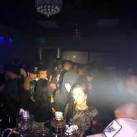 <p>Maskless partiers crammed inside the illegal club.</p>