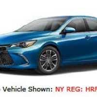 <p>2017 blue Toyota Camry</p>