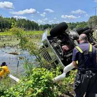 <p>The truck appeared to roll off the road and towards a body of water.</p>