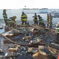 <p>Hasbrouck Heights firefighters up on the roof.</p>